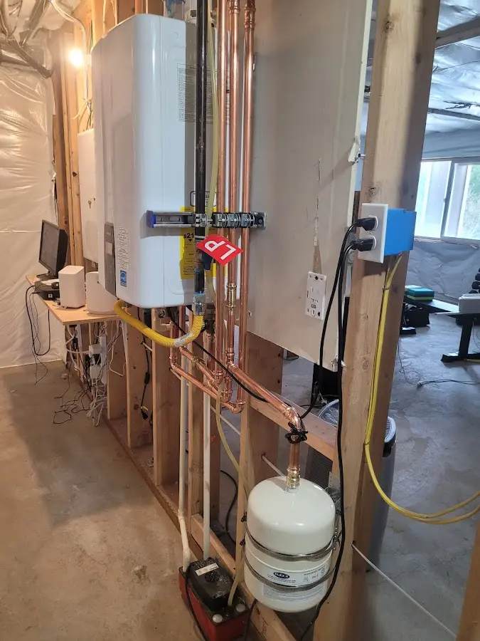 Licensed plumber repairing a kitchen sink in Freedom